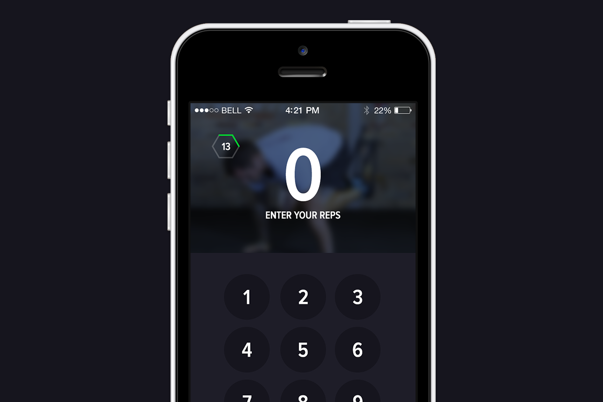 Smartphone screen displaying a workout tracking app with a keypad for entering reps.